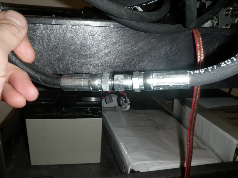 Crimped industrial hose ends on a machine