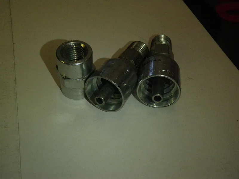 Steel hydraulic hose fittings and ferrules